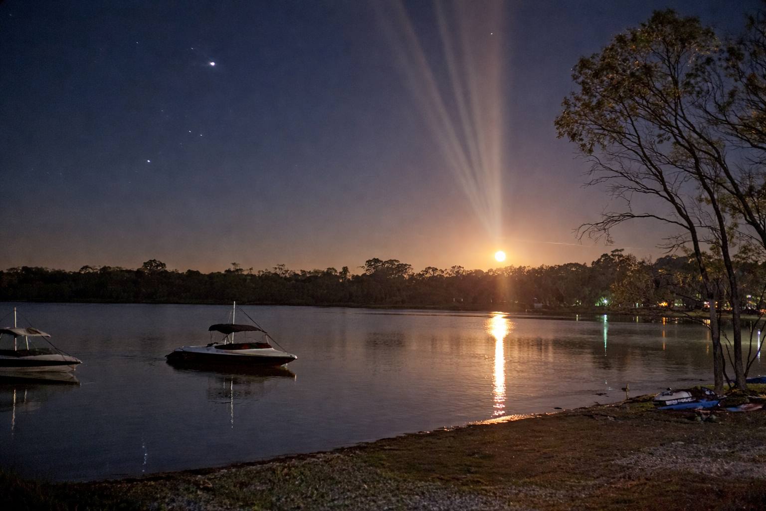 Boats on Green Lake under moonlight